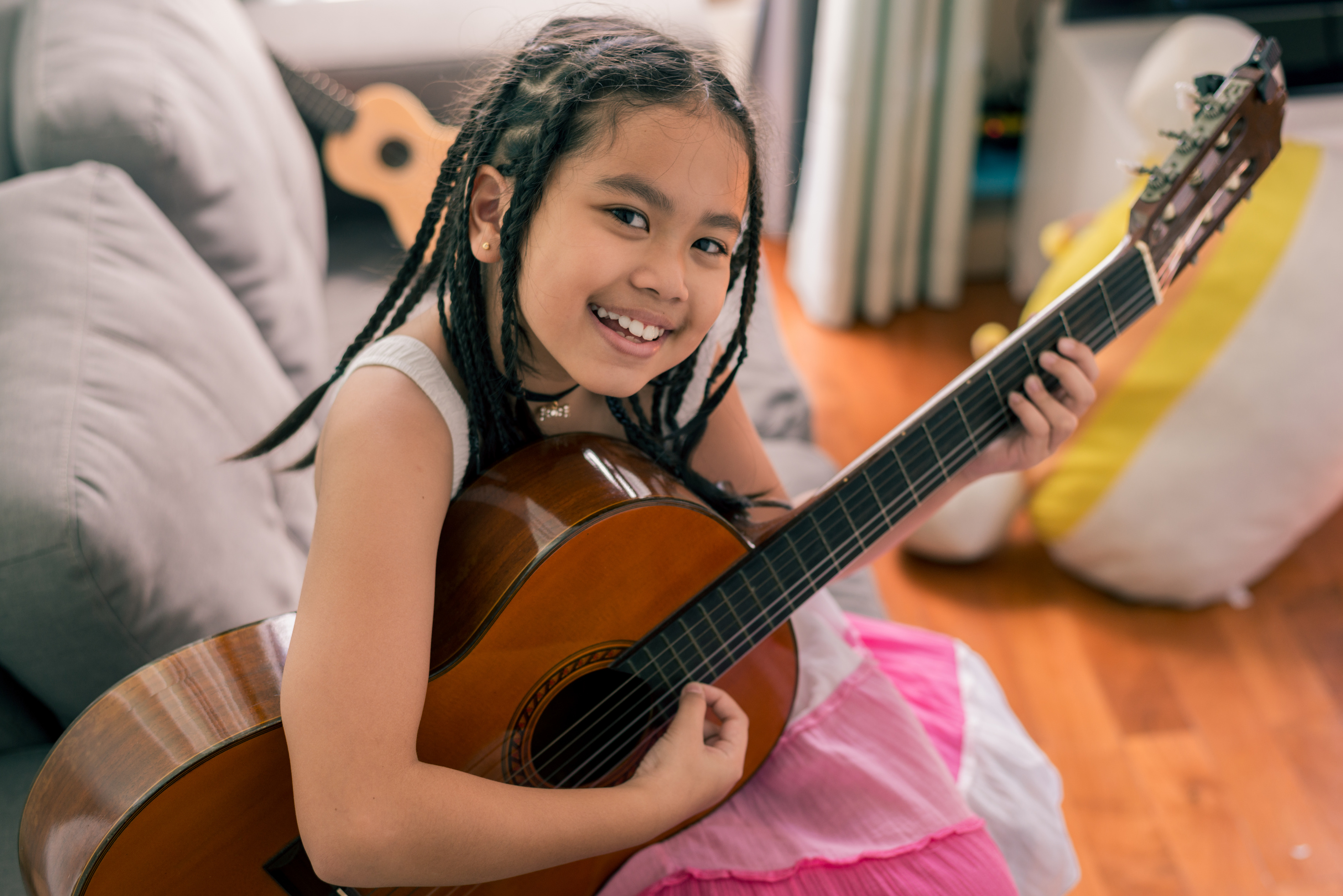 girl playing musical instrument