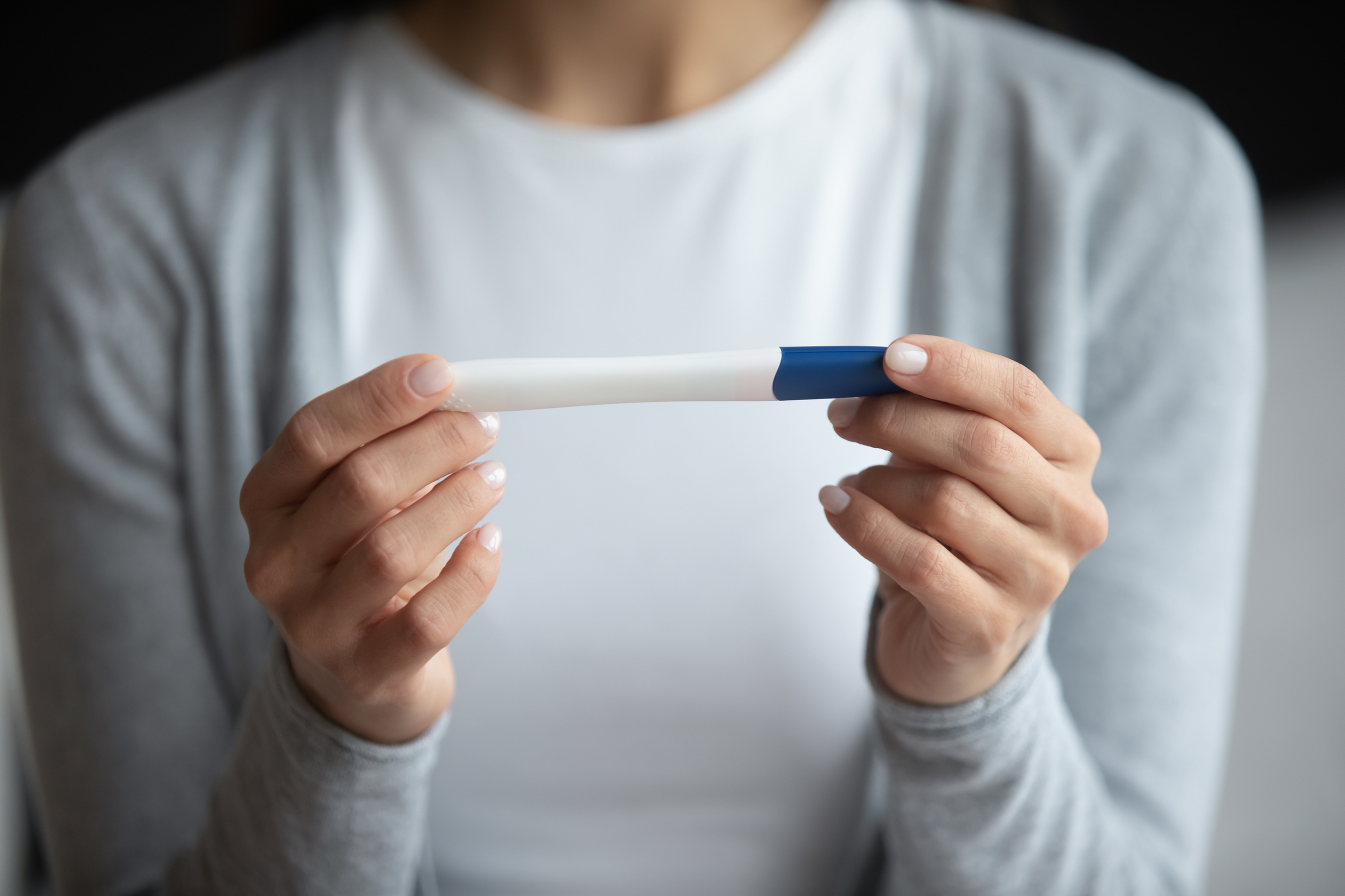 Woman Holding Pregnancy Test